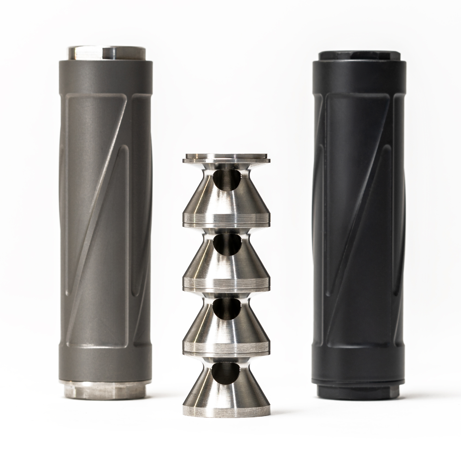 NYX Mod2 titanium K-baffle stack disassembled between natural titanium and Graphite Black suppressor bodies